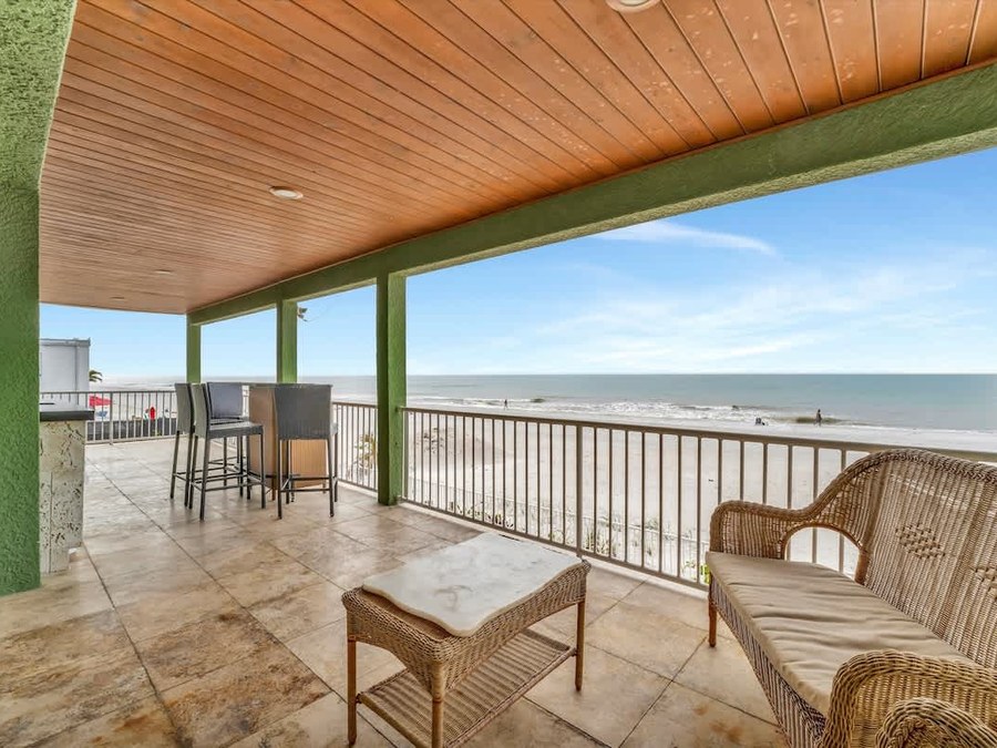 Beachfront covered balcony at a Florida vacation rental