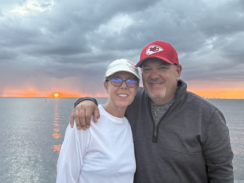 Susan and her partner at sunset